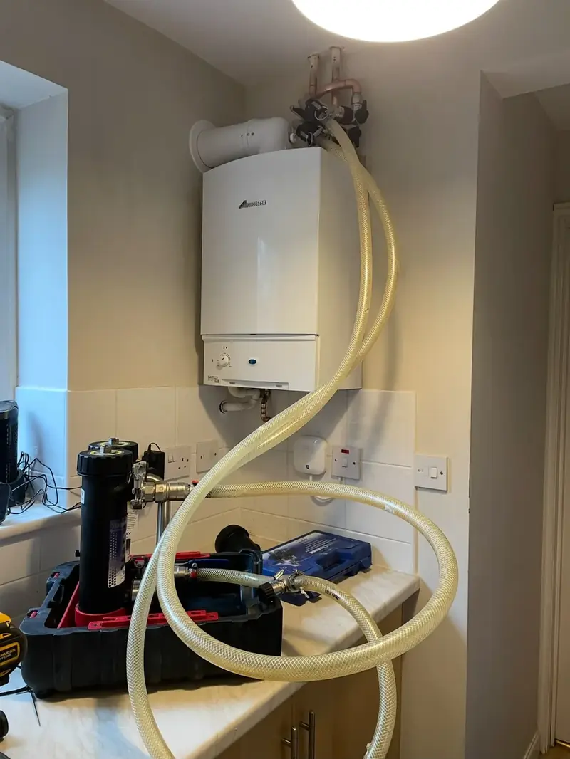 Power flush running on a Worcester boiler with a magnetic filter connected