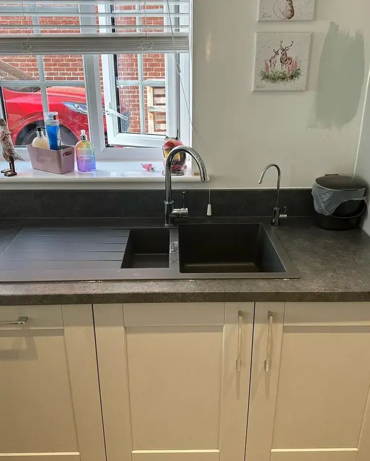 New kitchen sink and mixer tap fitted into a worktop